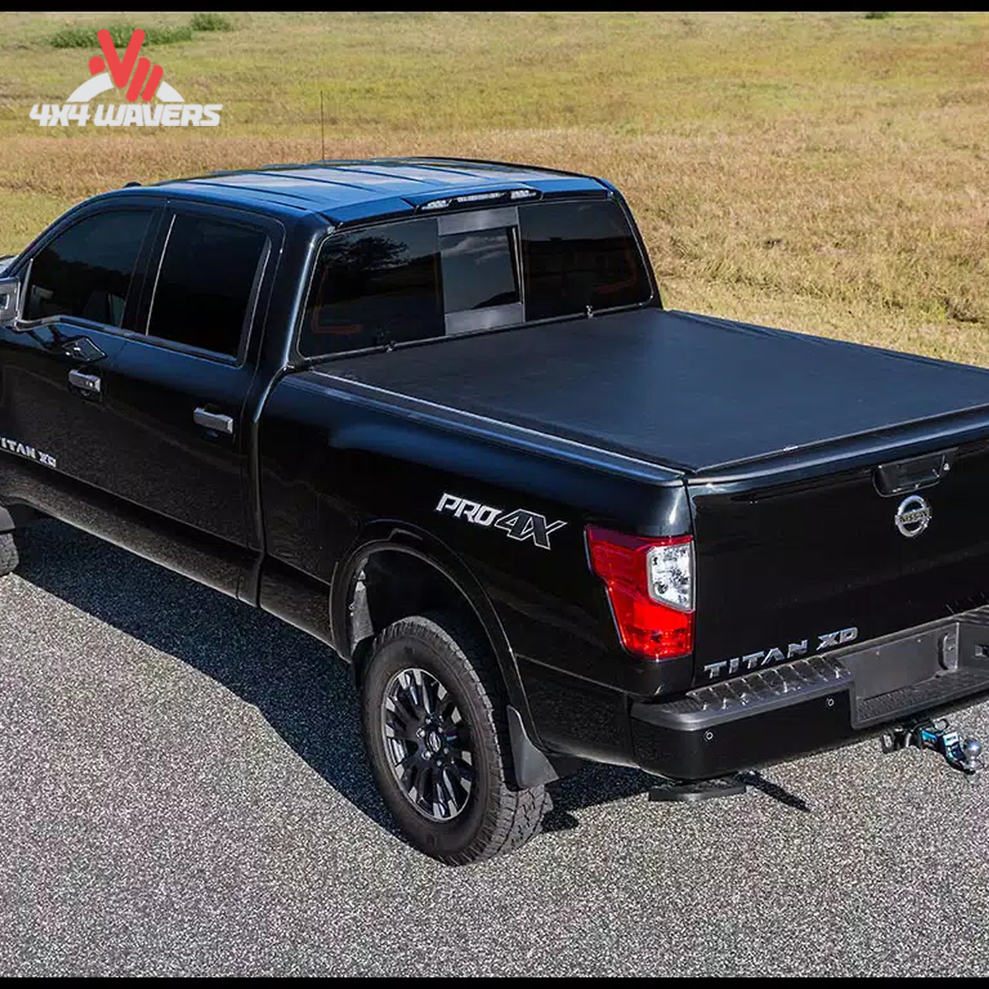 A low profile black vinyl soft roll up truck bed cover installed on a short box Ford F-150 Lightning SKU BGPC_22010369.