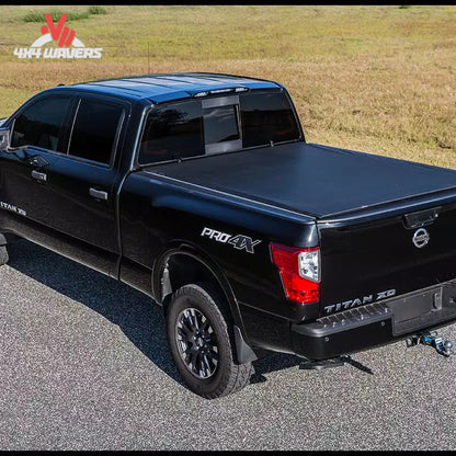 A low profile black vinyl soft roll up truck bed cover installed on a short box Ford F-150 Lightning SKU BGPC_22010369.