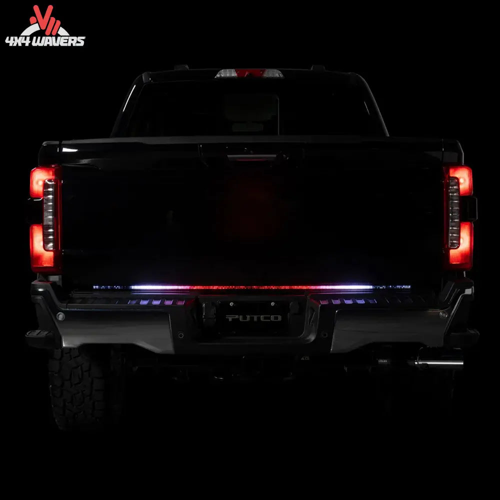 Putco Freedom Blade LED tailgate light bar installed on a 2005-2026 Toyota Tacoma, showcasing bright LED lighting on the tailgate.
