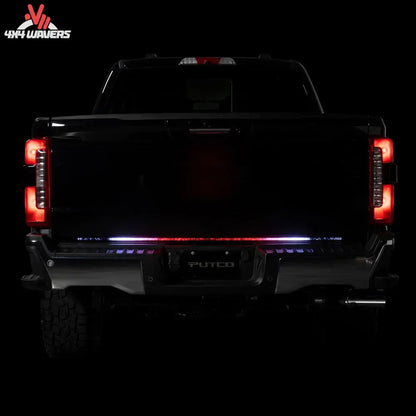 Putco Freedom Blade LED tailgate light bar installed on a 2005-2026 Toyota Tacoma, showcasing bright LED lighting on the tailgate.
