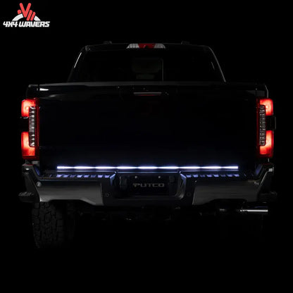 Putco Freedom Blade LED tailgate light bar installed on a 2005-2026 Toyota Tacoma, showcasing bright red LED tailgate lighting.