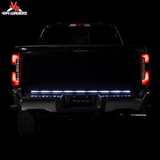 Putco Freedom Blade LED tailgate light bar installed on a 2005-2026 Toyota Tacoma, showcasing bright red LED tailgate lighting.