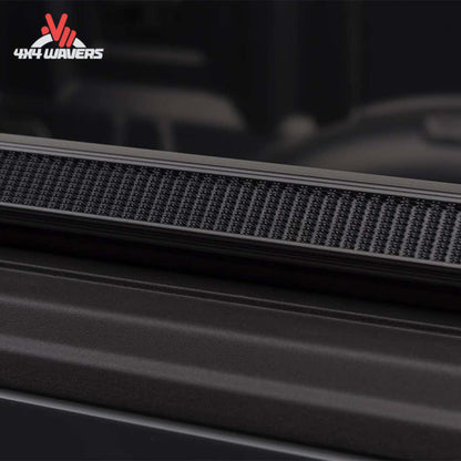 TruXedo TruXport soft roll-up tonneau cover on a 2009-2014 Ford F-150 with 5.5-foot bed, showing the cover rolled up over the truck bed.
