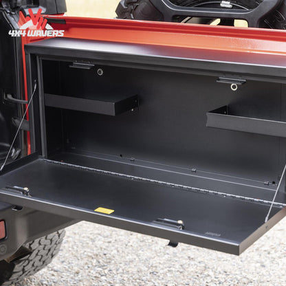 Jeep Wrangler JL tailgate lockbox door functioning as an outdoor workbench for camping and trail repairs