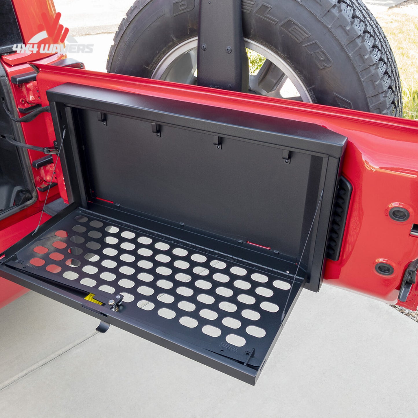 Open MOLLE tailgate lockbox showing secure storage area and removable organization trays