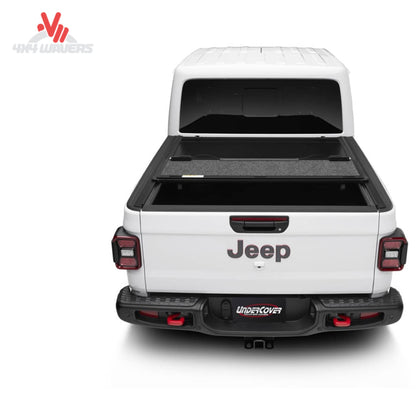 Premium hard folding tonneau cover showing protective carpet-lined panel construction