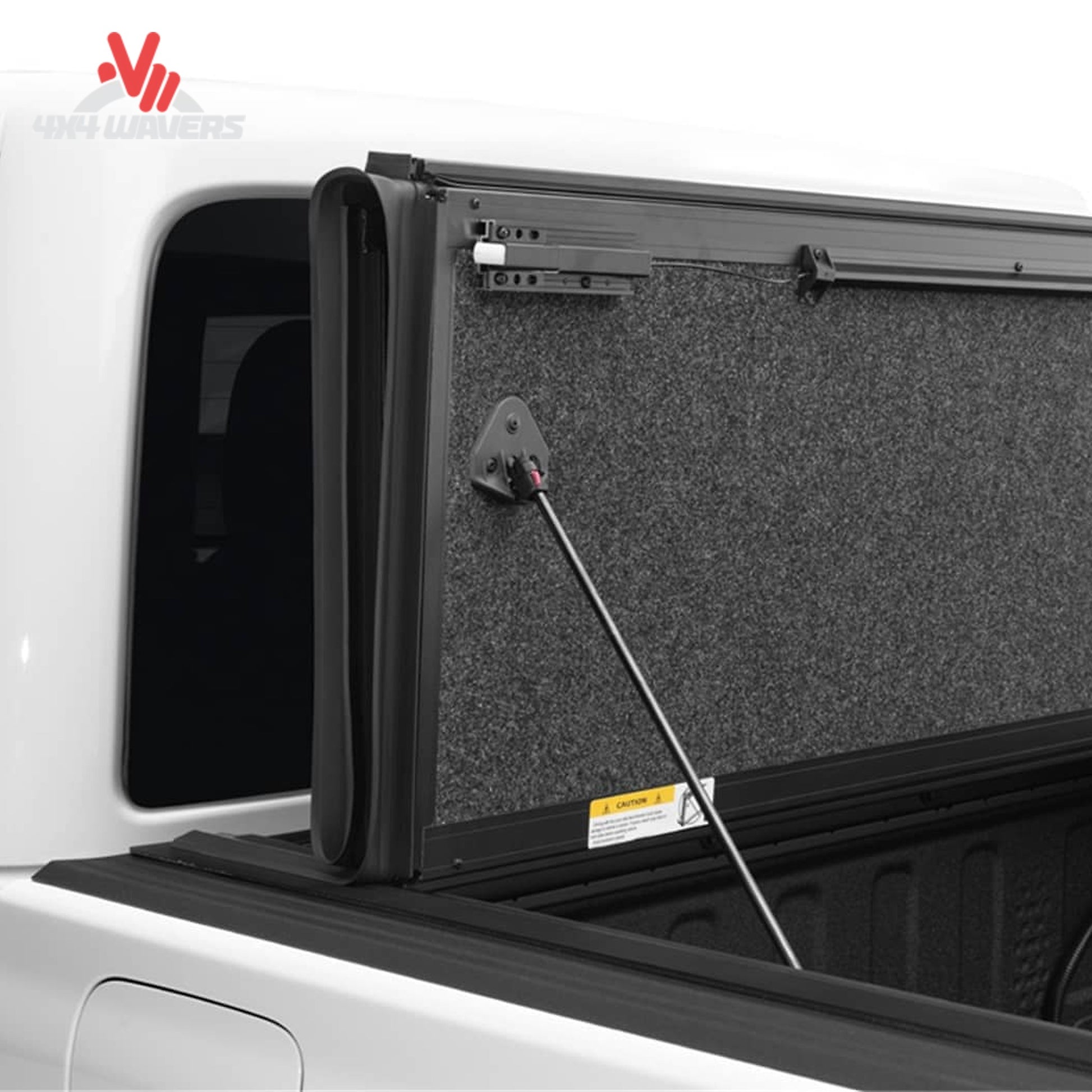 Premium hard folding tonneau cover showing protective carpet-lined panel construction
