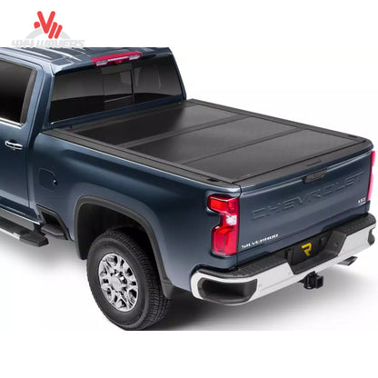 UnderCover Flex hard folding tonneau cover on 2004-2014 Ford F-150 with 6.5-foot bed, showing the black protective cover and fold sections.