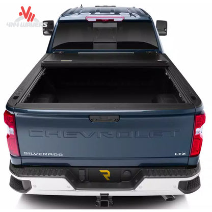 UnderCover Flex hard folding tonneau cover installed on 2004-2014 Ford F-150 with 6.5-foot bed, providing secure truck bed coverage.