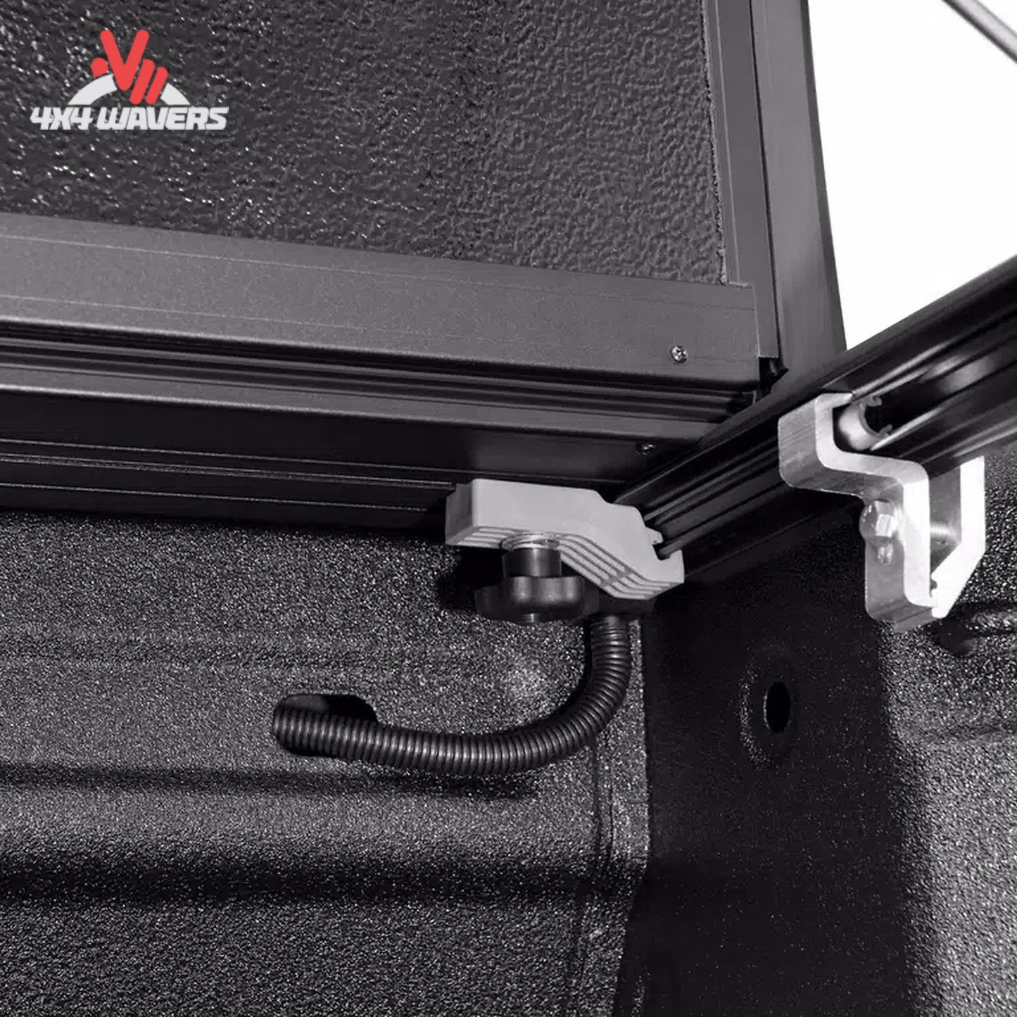 Close up of dual prop rods and secure buckles for full bed cargo access FX21002