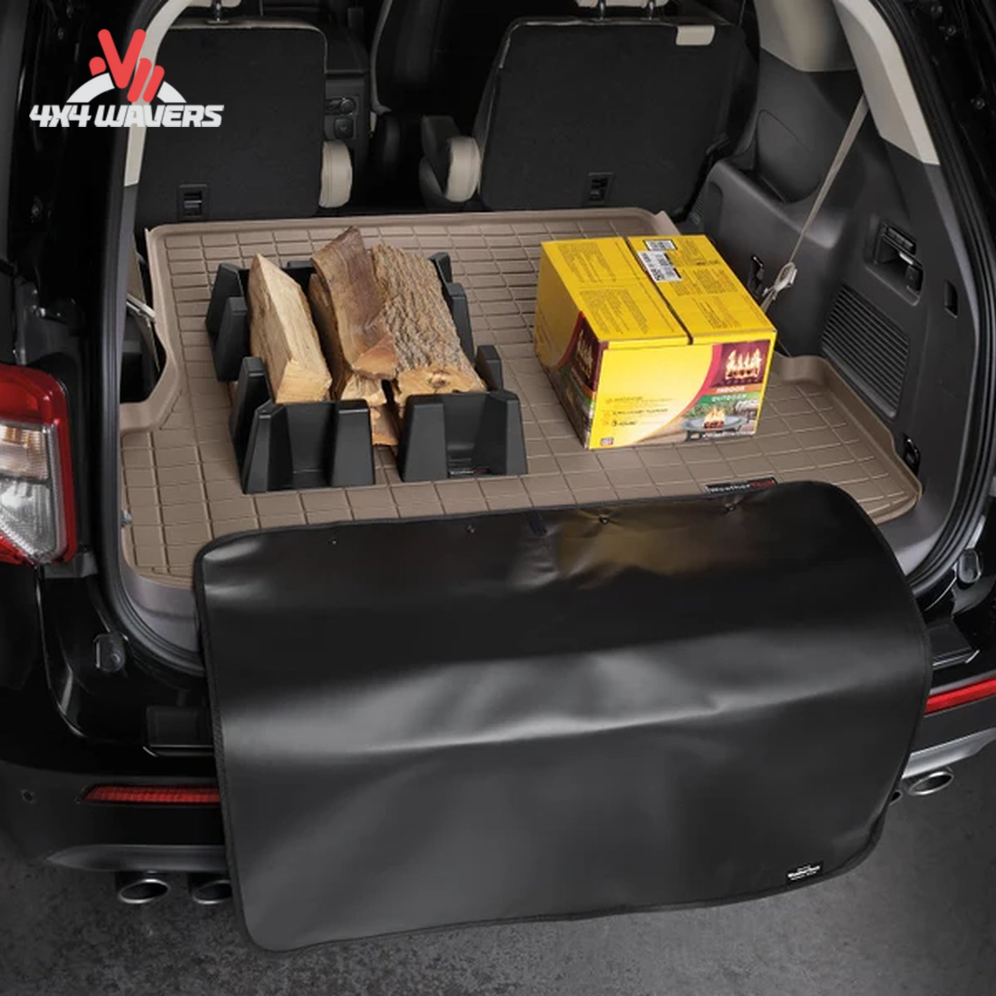 Fold-out bumper protector shielding painted Jeep Wrangler surfaces while loading camping and recovery gear