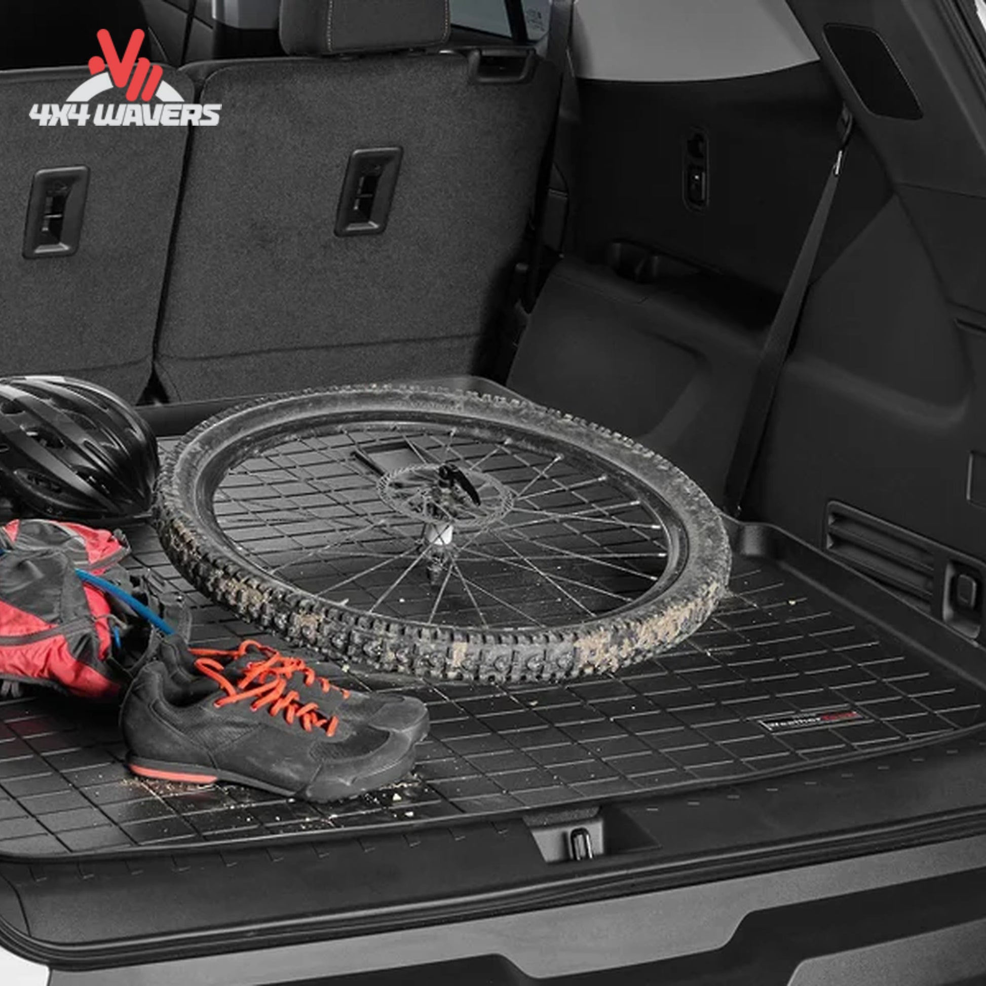 Close-up of raised cargo liner edge designed to contain water mud and spills