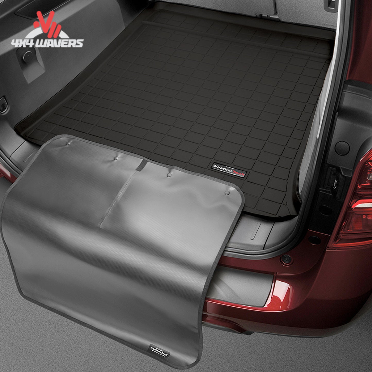 WeatherTech bumper protector extended over the rear bumper to prevent scratches while loading camping gear and equipment