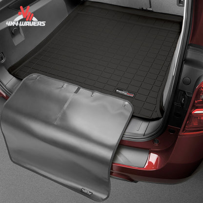WeatherTech bumper protector extended over the rear bumper to prevent scratches while loading camping gear and equipment