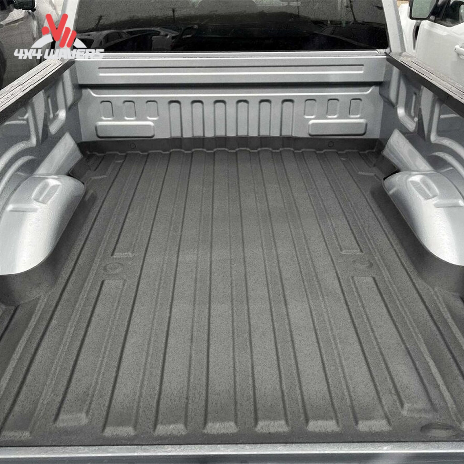 Top angle view of Ford F150 truck bed with installed black WeatherTech ImpactLiner mat 36927IM