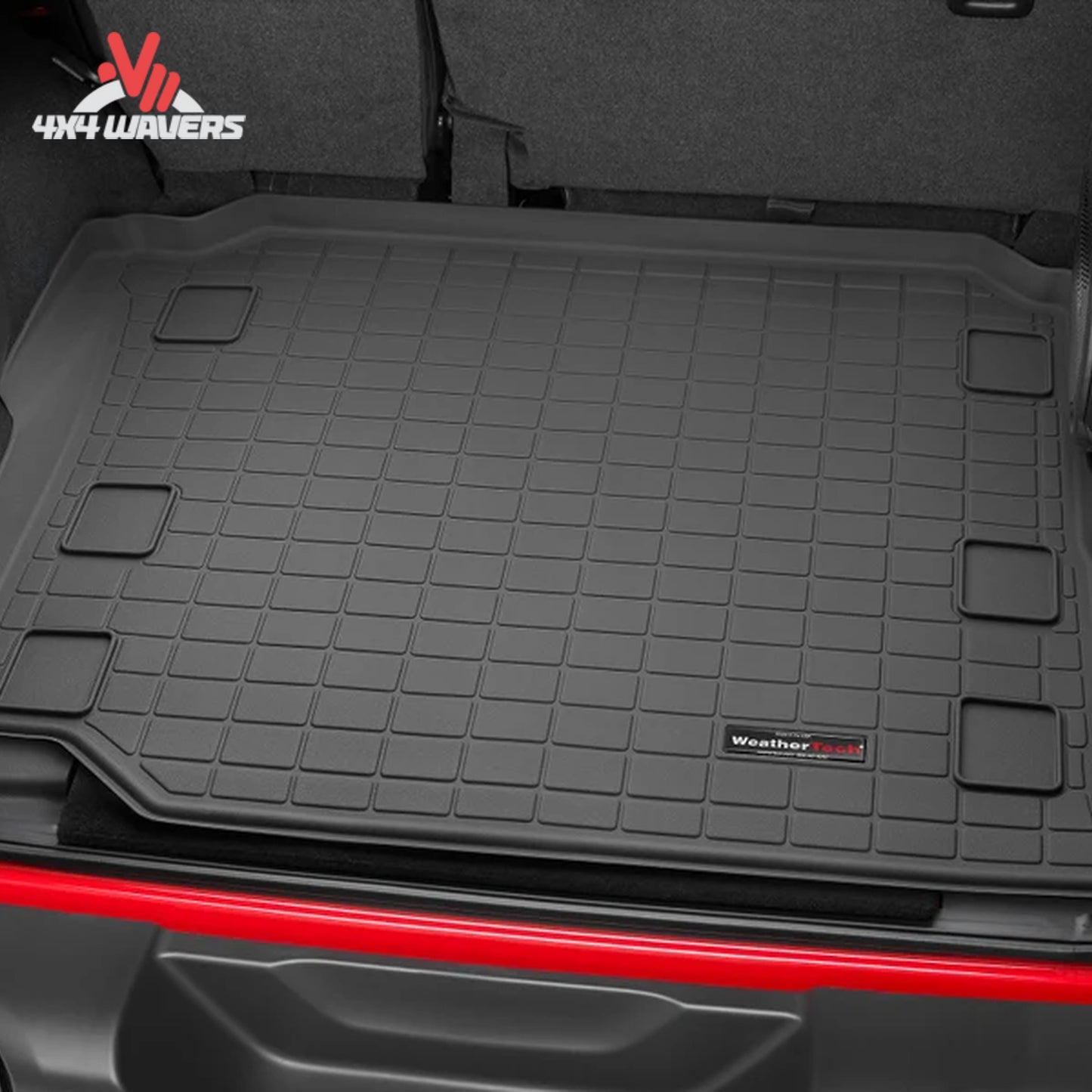 Jeep Wrangler JL Unlimited cargo compartment protected by a WeatherTech cargo liner designed for factory subwoofer applications