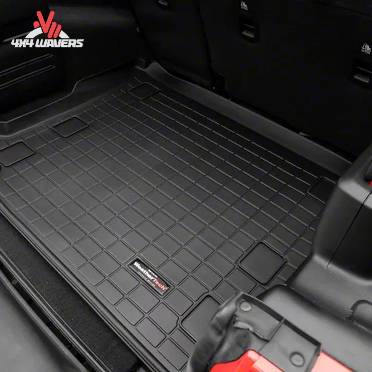 Jeep Wrangler JL Unlimited cargo area protected by a WeatherTech cargo liner designed for flat load floor applications