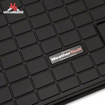 Durable skid-resistant cargo liner surface helping secure camping gear tools and recovery equipment