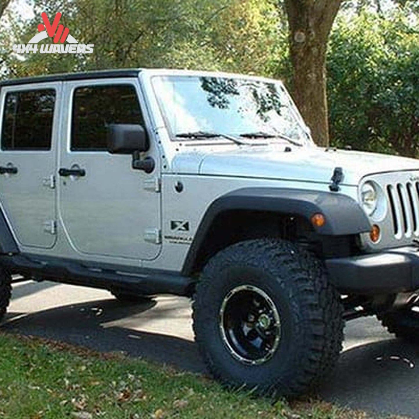 Close-up view of suspension geometry correction and lift components installed on a Wrangler Unlimited