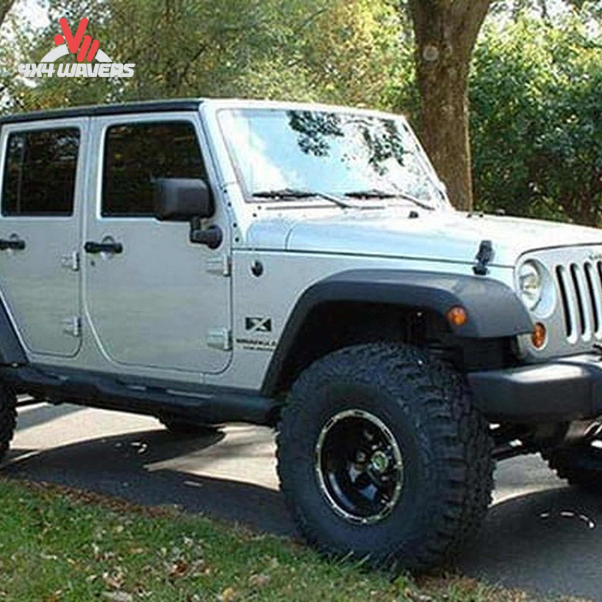 Close-up view of suspension geometry correction and lift components installed on a Wrangler Unlimited