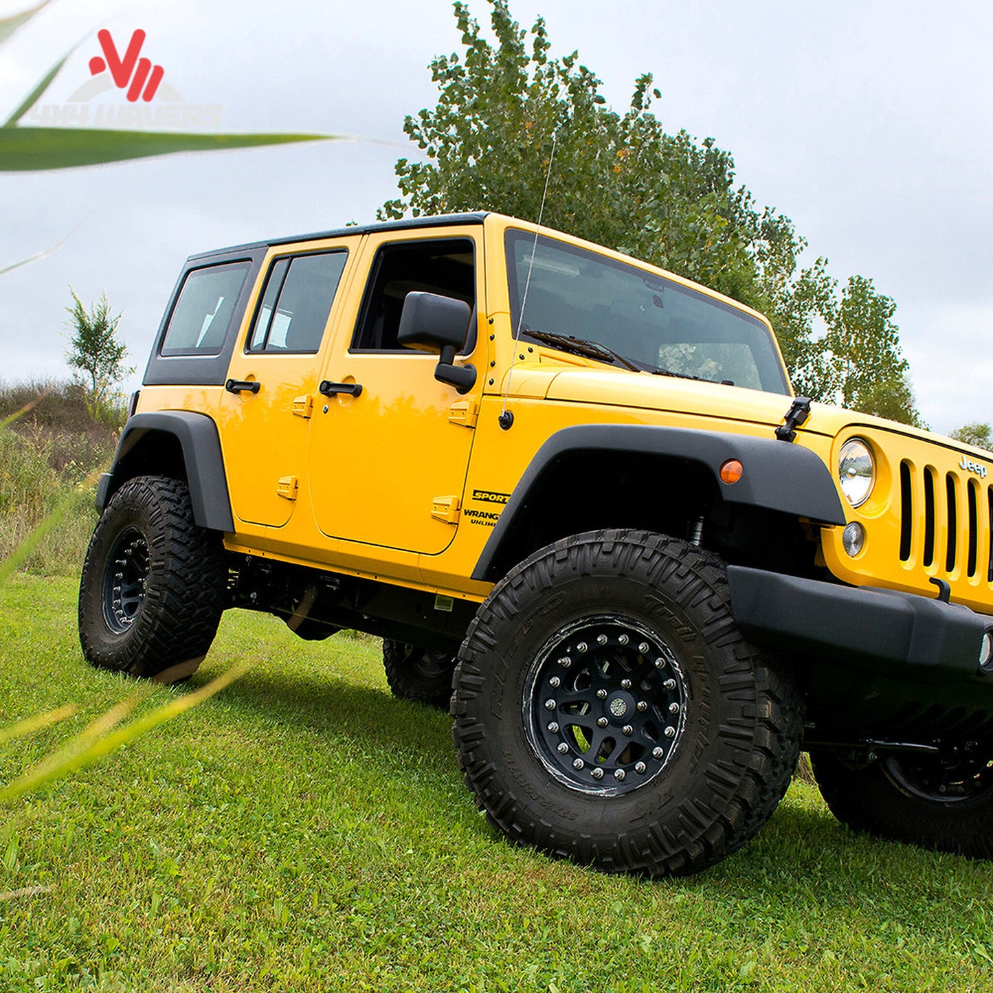 Close-up view showing suspension geometry correction and lifted ride height on a Wrangler Unlimited