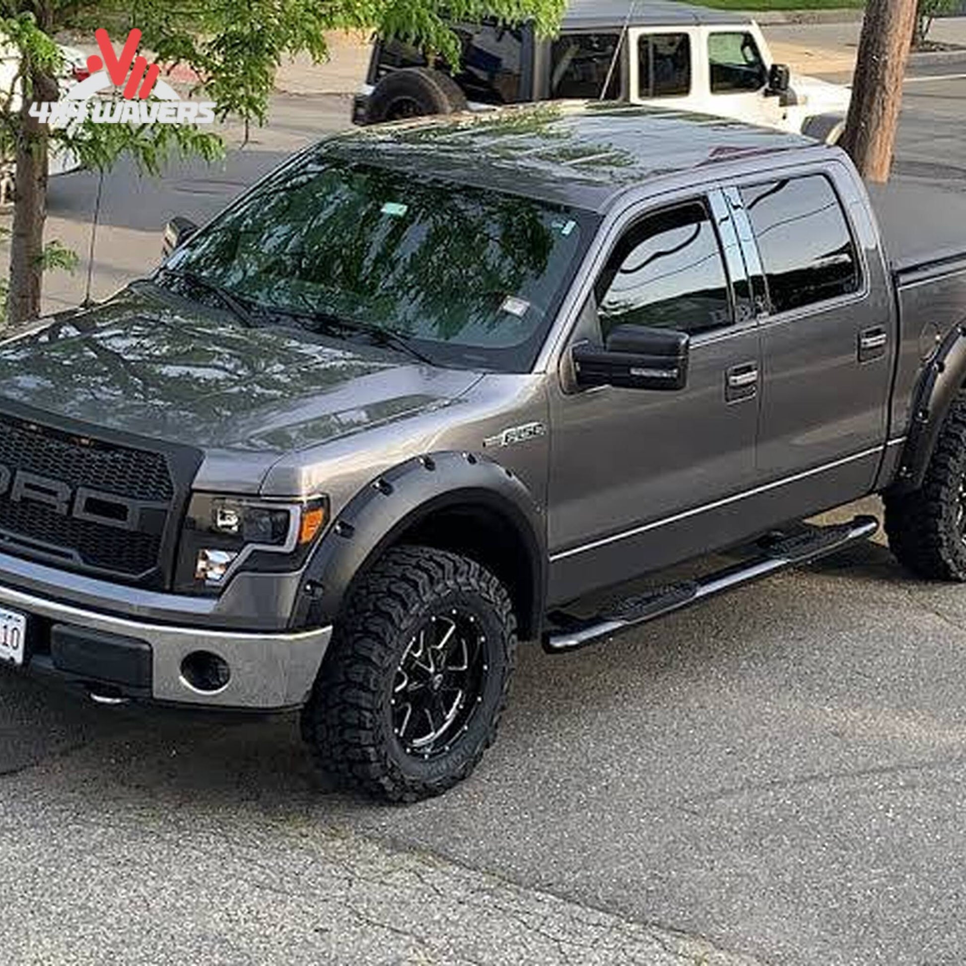 Side profile view of Ford F150 truck with installed 4 piece black pocket flares KF00102