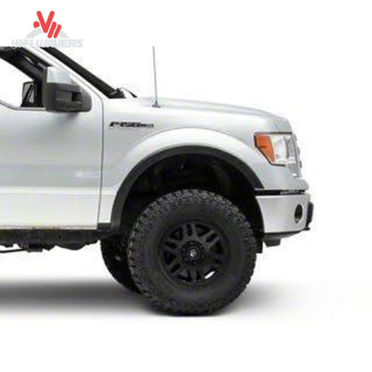 Set of four Xtreme OE style Fender Flares installed on a 2009-2014 Ford F-150 truck, enhancing wheel arch protection and style.